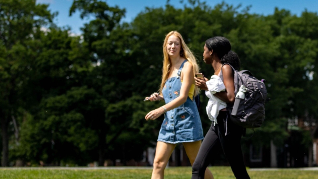 Two students walking on campus.