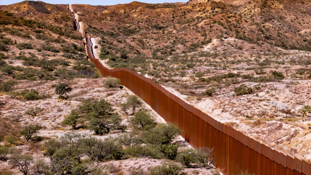 Wall between U.S. and Mexico in Arivaca, Arizona (Photo by Nils Huenerfuerst)